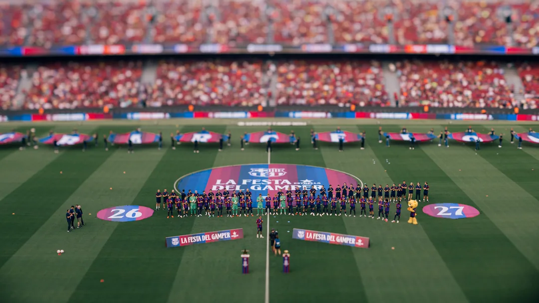 The FC Barcelona squad lined up on the pitch at Spotify Camp Nou for the Joan Gamper Trophy presentation, giant club flags behind