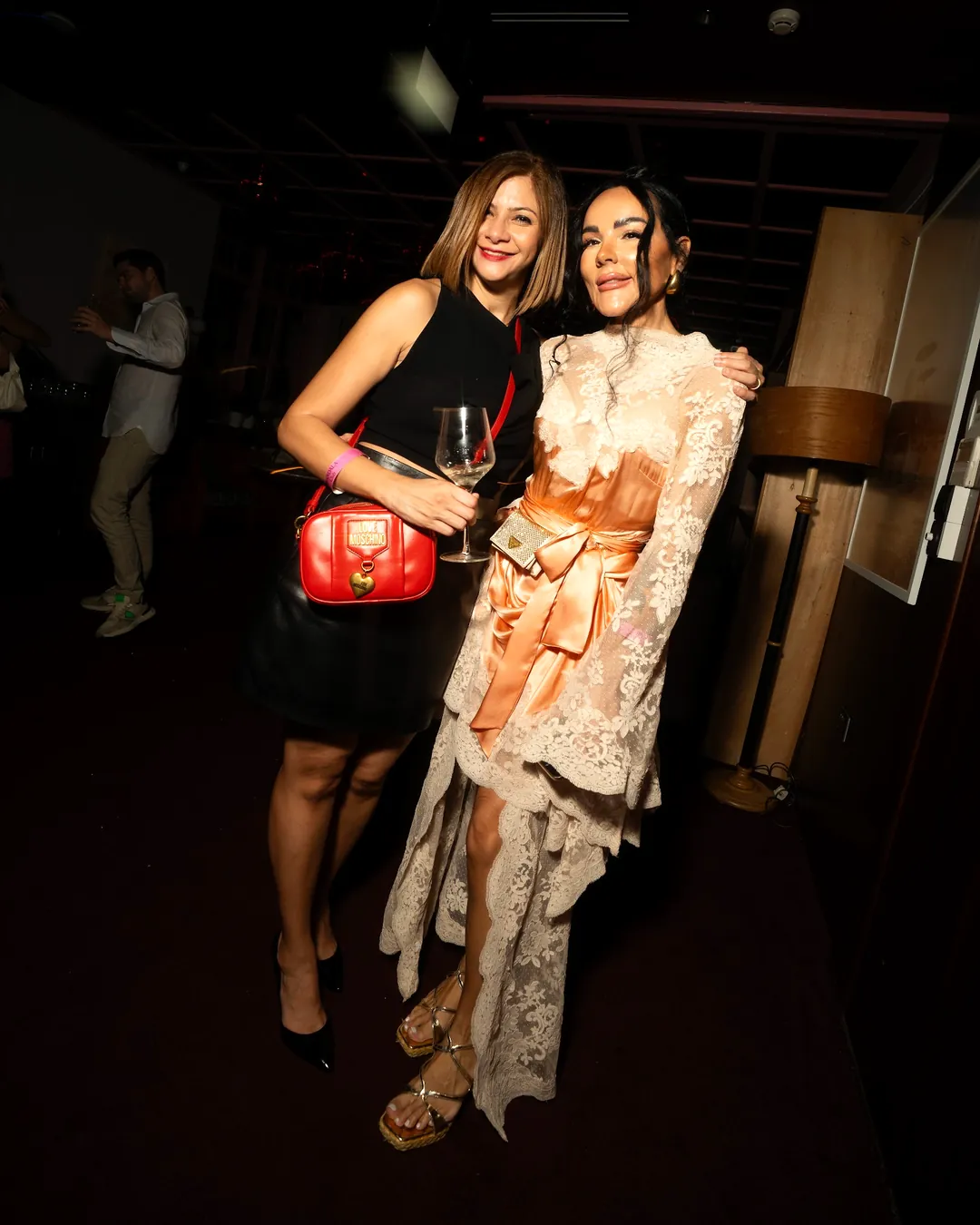 Two guests in evening dress at the Mandala Club party